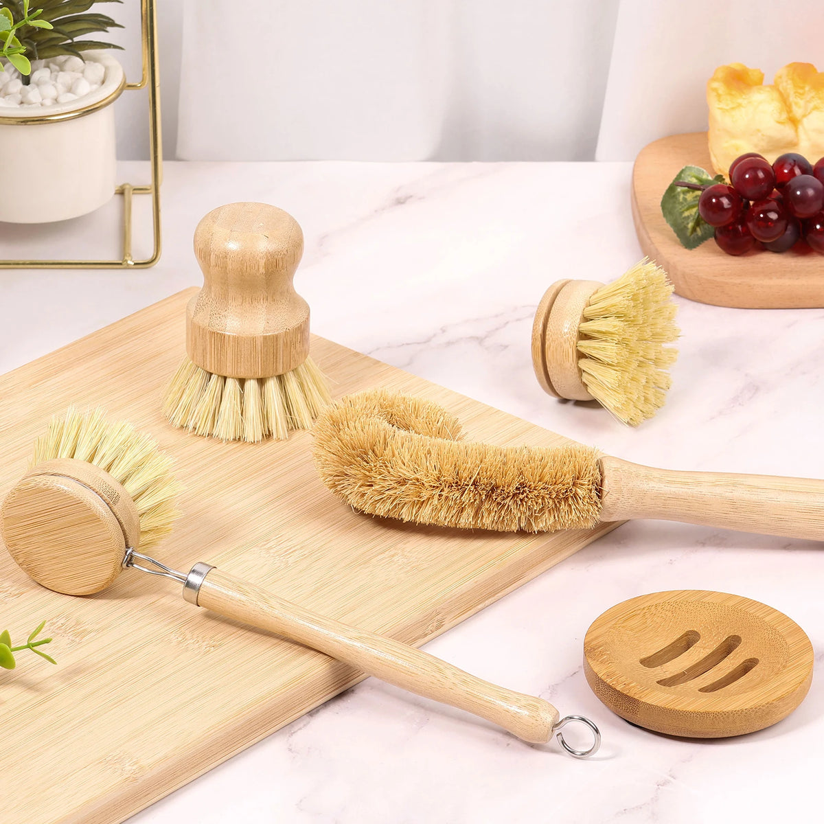 Bamboo dish brush set arranged on a kitchen worktop with long and compact brush shapes