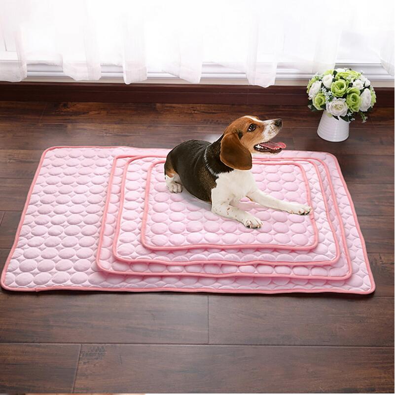 Pink quilted cooling pet mat shown with a small dog resting on the nested size set