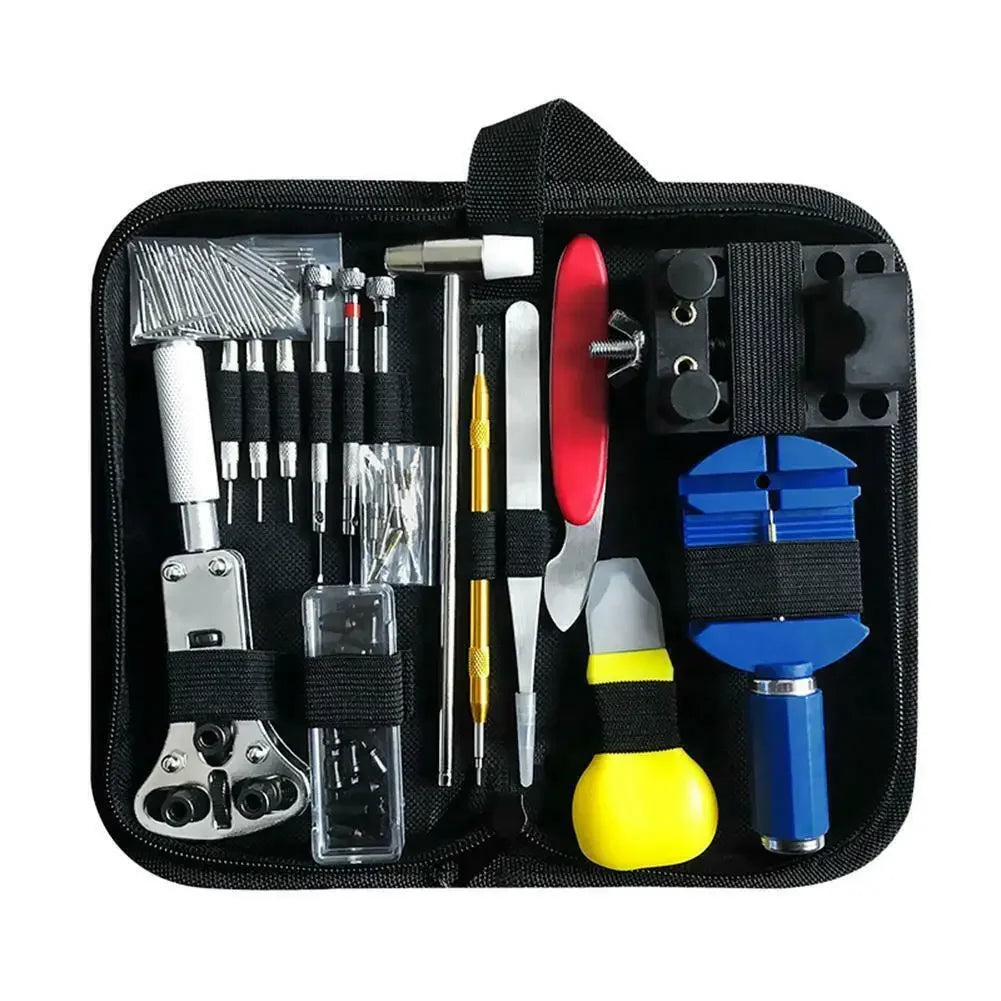 Open black watch repair kit showing the organized assortment of tools